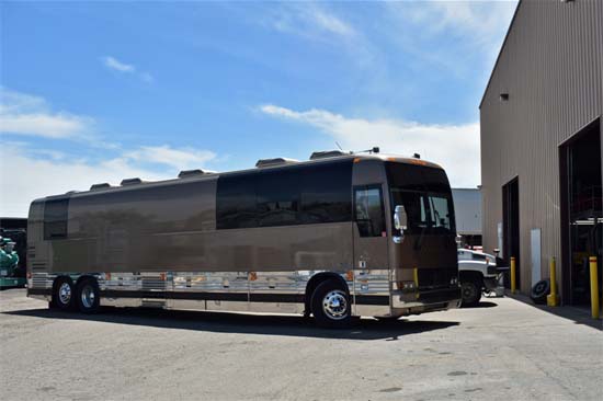 Tour Bus Entering Shop for Repairs
